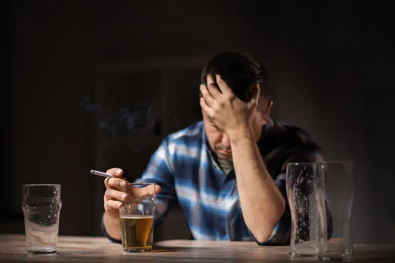Man Smoking and Drinking Alcohol, Treatment in Paragon AL